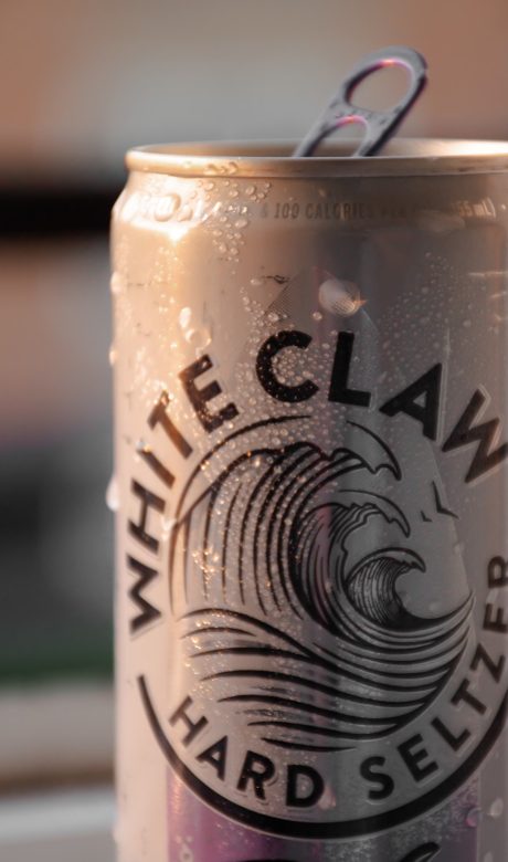 close up of the top part of a White Claw can.